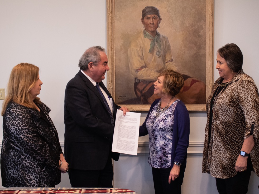 Melissa Currey, Chief Standing Bear, Superintendent Phillips, Lynn Holloway pose for a picture after signing the Tulsa Airpark into Federal Trust 